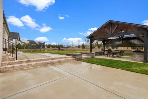an aerial view of a house with a garden and trees