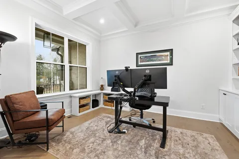 a kitchen with granite countertop a sink cabinets and window