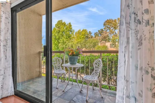 a view of balcony with furniture