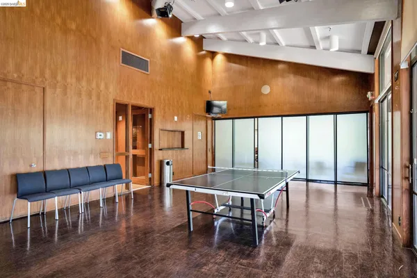 a room with gym equipment and windows