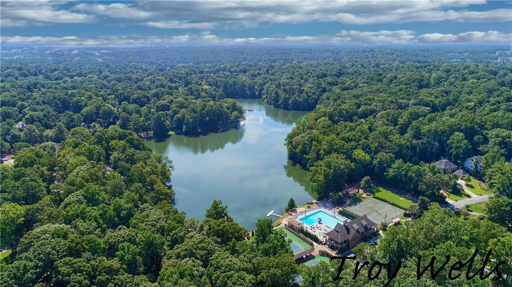 an aerial view of residential house with outdoor space and lake view