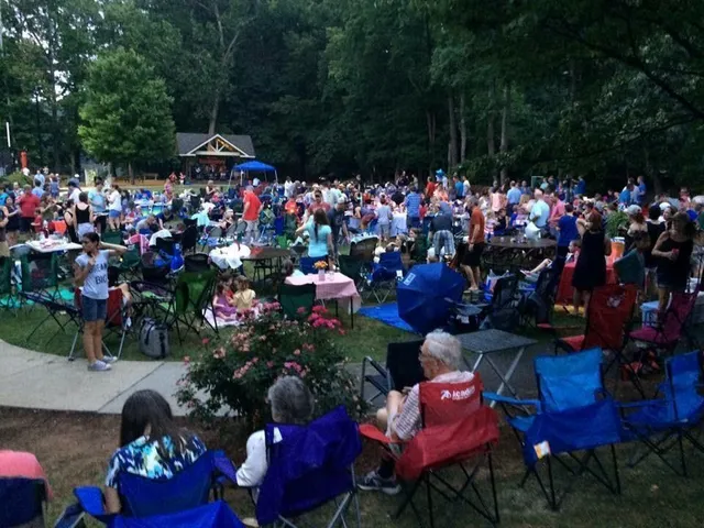 a group of people standing around a fruit stand