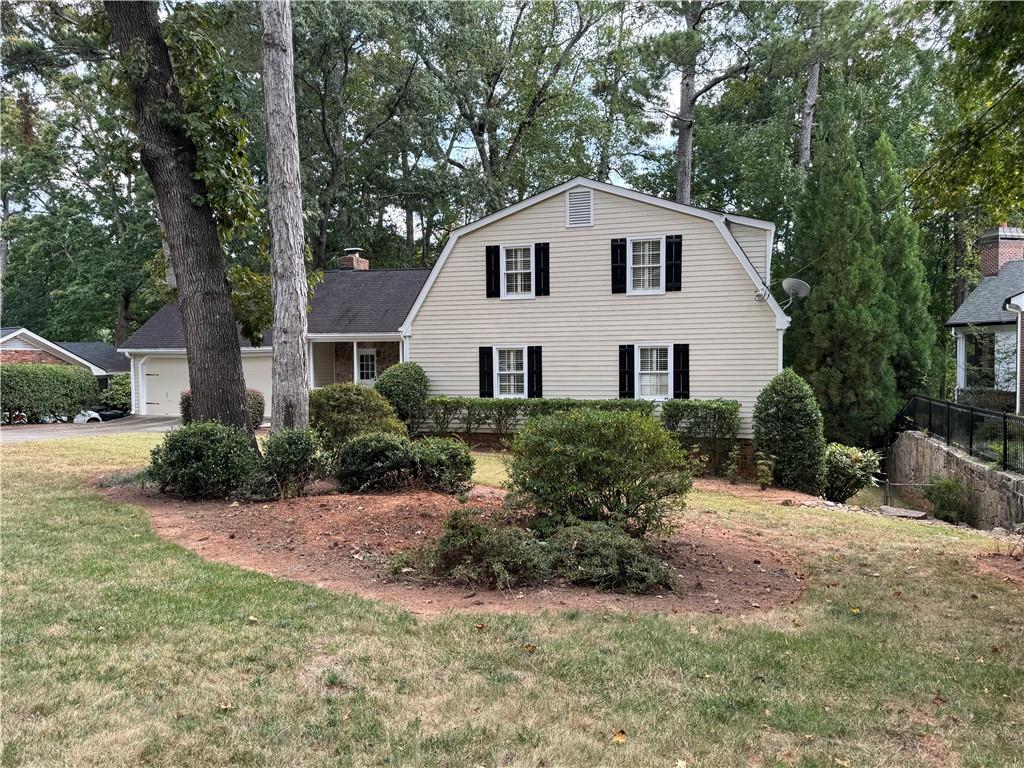 1359 Ragley Hall Road Northeast Brookhaven, GA 30319 - Photo 4 of 23 a view of a house with a yard