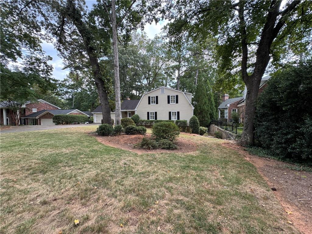 1359 Ragley Hall Road Northeast Brookhaven, GA 30319 - Photo 8 of 23 a view of a house with a yard and tree s