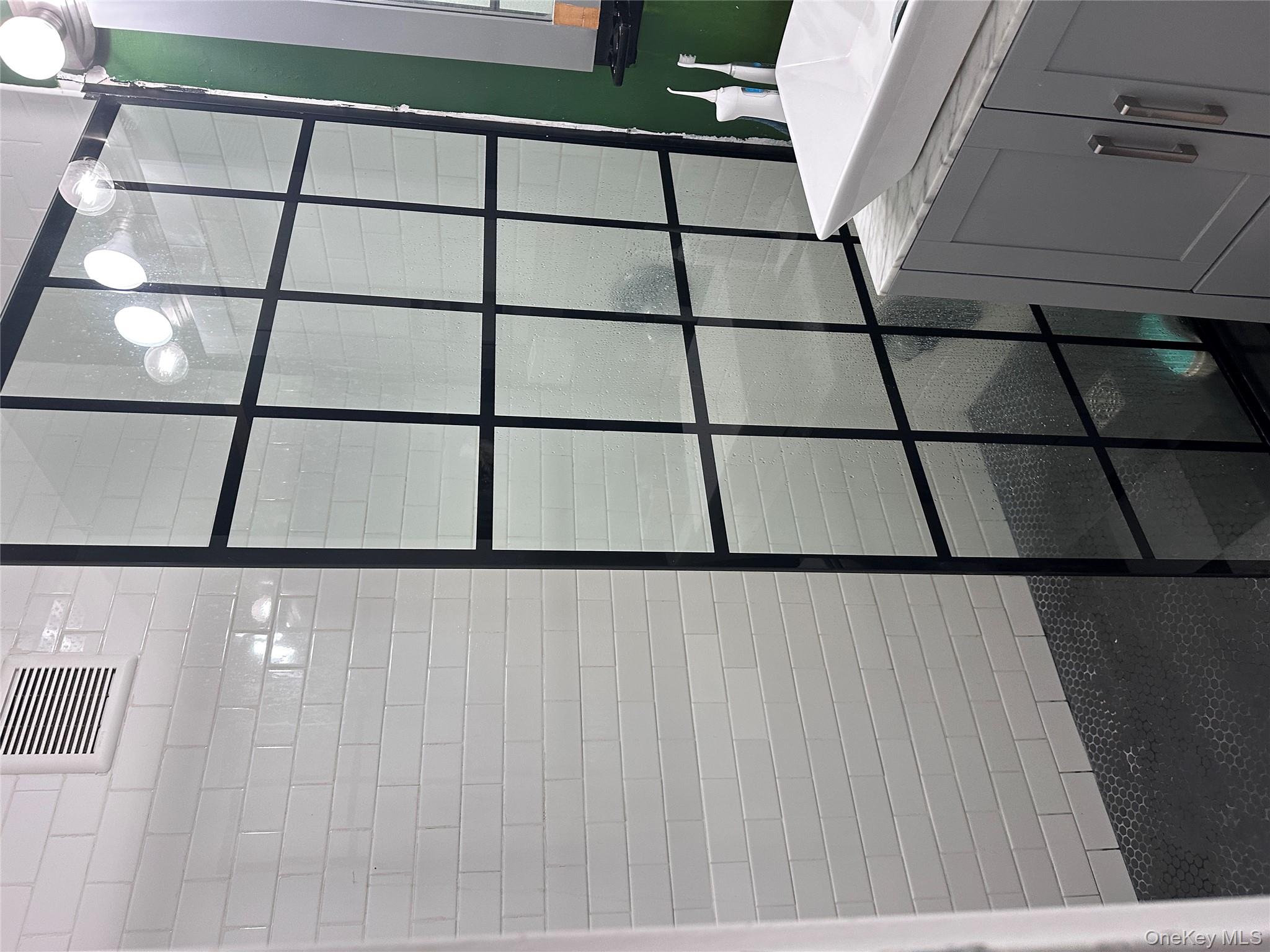 250 West Merrick Road, Unit 2F Freeport, NY 11520 - Photo 15 of 30 a bathroom with a shower