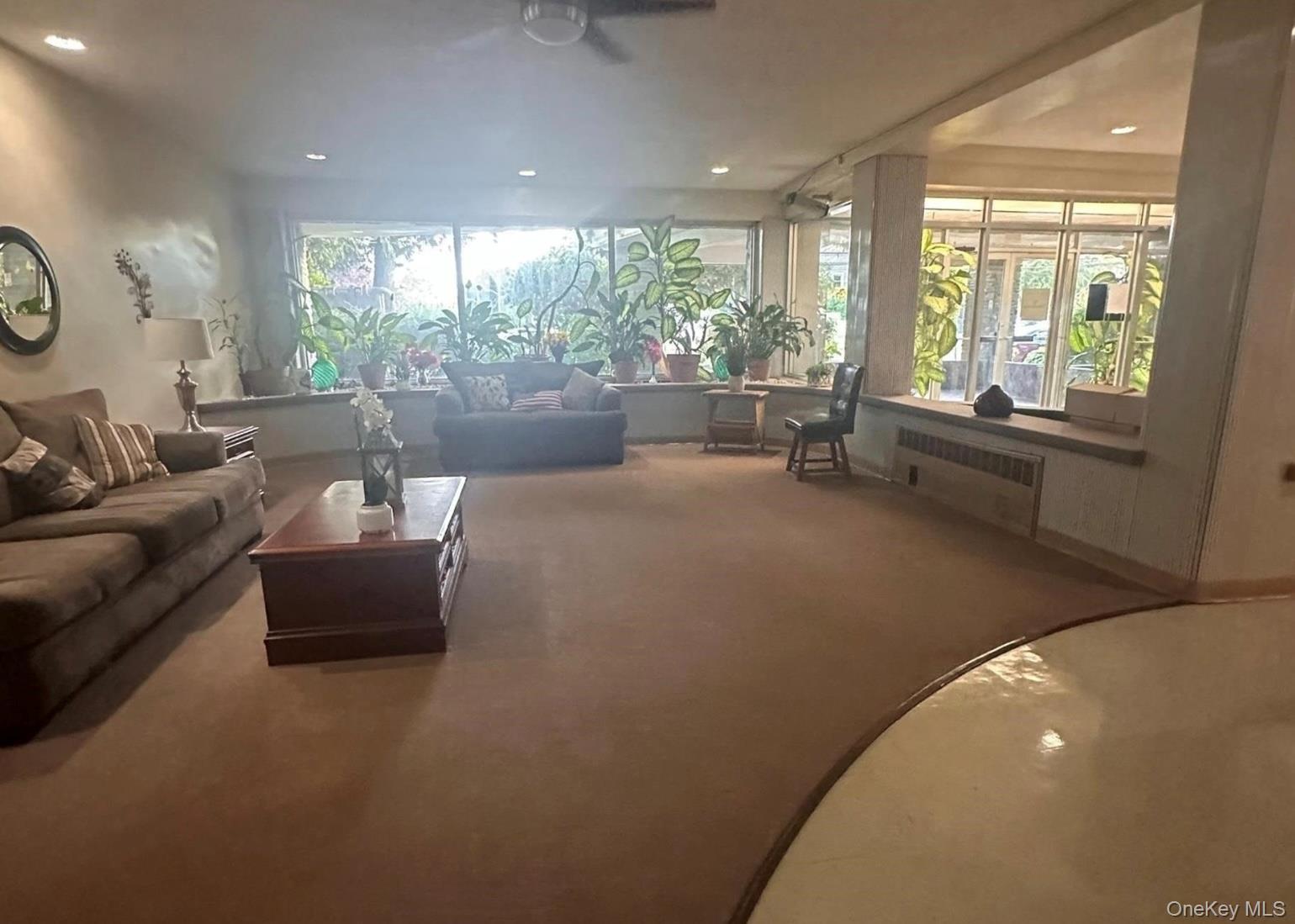 250 West Merrick Road, Unit 2F Freeport, NY 11520 - Photo 24 of 30 a living room with furniture and a large window