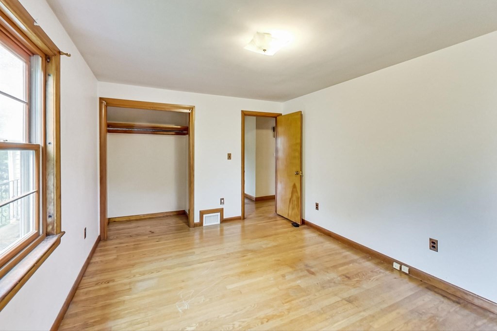 22 Ferry Road Salisbury, MA 01952 - Photo 18 of 34 a view of an empty room with window and wooden floor