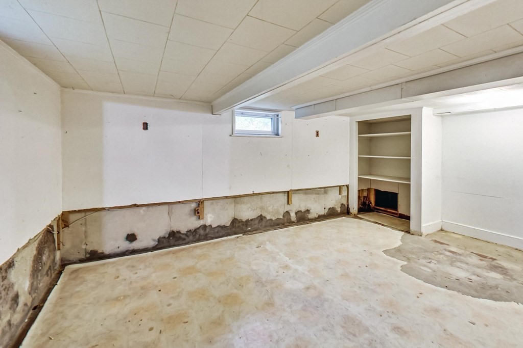 22 Ferry Road Salisbury, MA 01952 - Photo 23 of 34 a view of an empty room with a fireplace and a window
