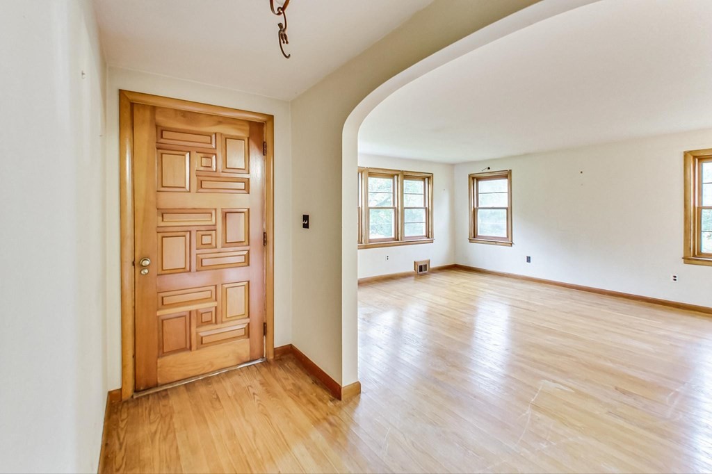22 Ferry Road Salisbury, MA 01952 - Photo 5 of 34 wooden floor in an empty room with a window