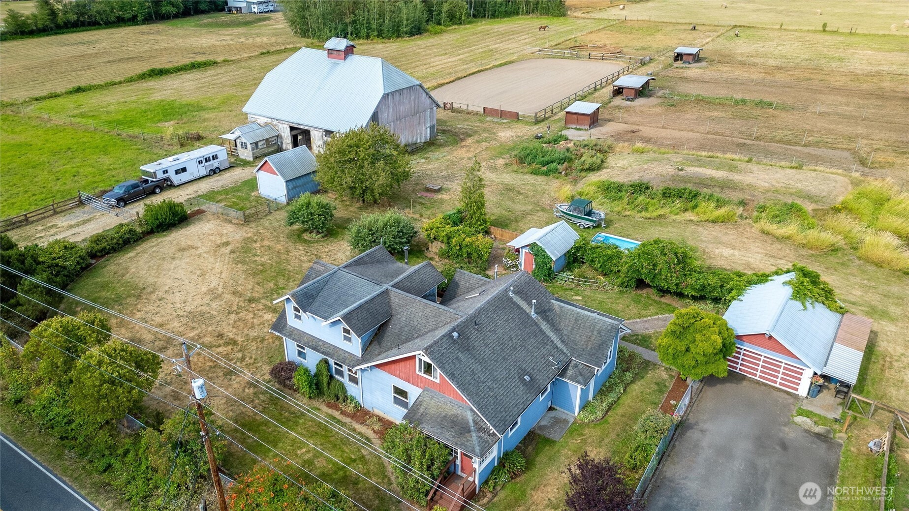 5149 Elder Road Ferndale, WA 98248 - Photo 1 of 40 an aerial view of a house with a yard and lake view