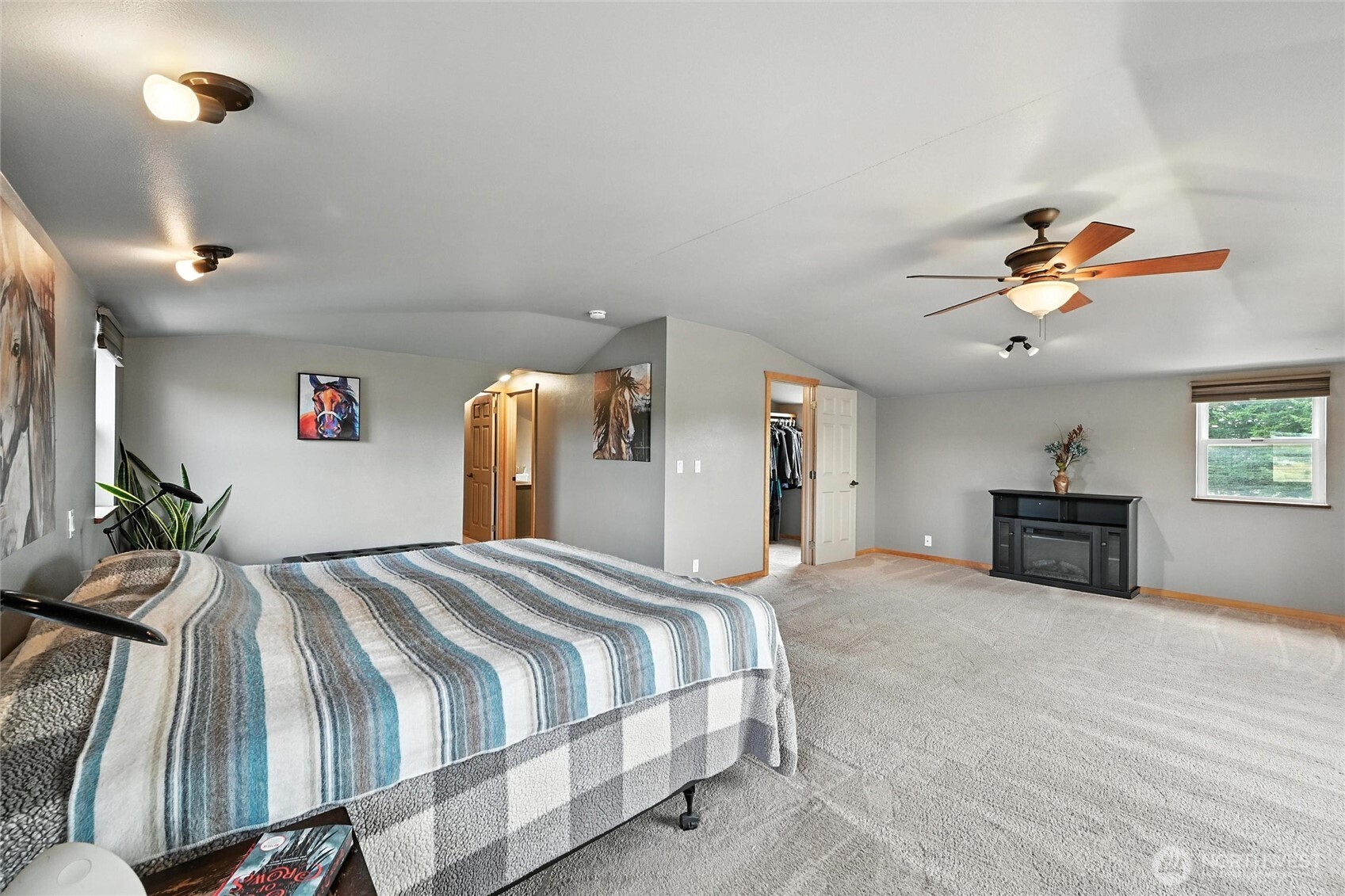 5149 Elder Road Ferndale, WA 98248 - Photo 18 of 40 a bed room with a bed and a chandelier