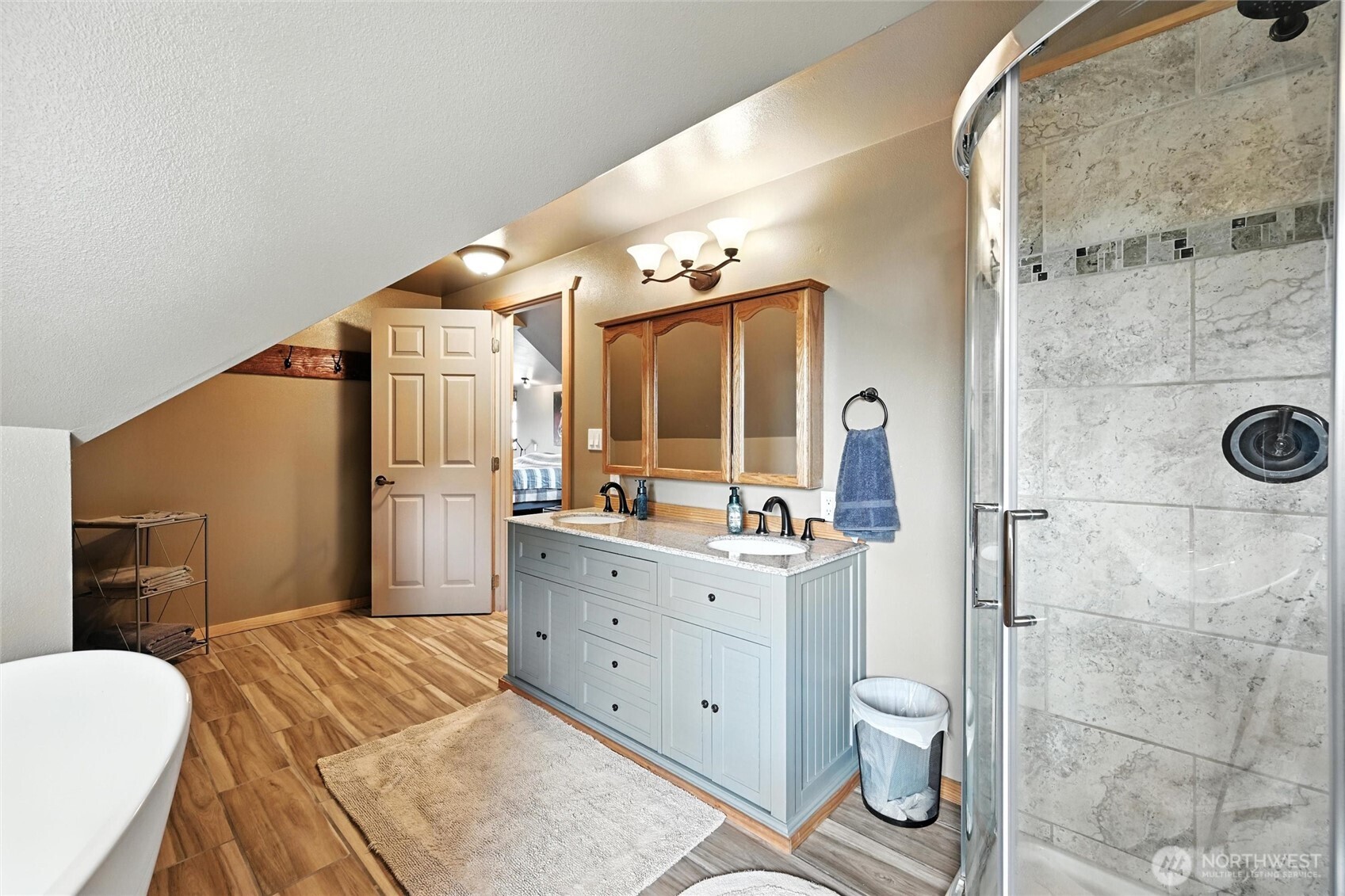 5149 Elder Road Ferndale, WA 98248 - Photo 22 of 40 a bathroom with a granite countertop sink mirror vanity and toilet