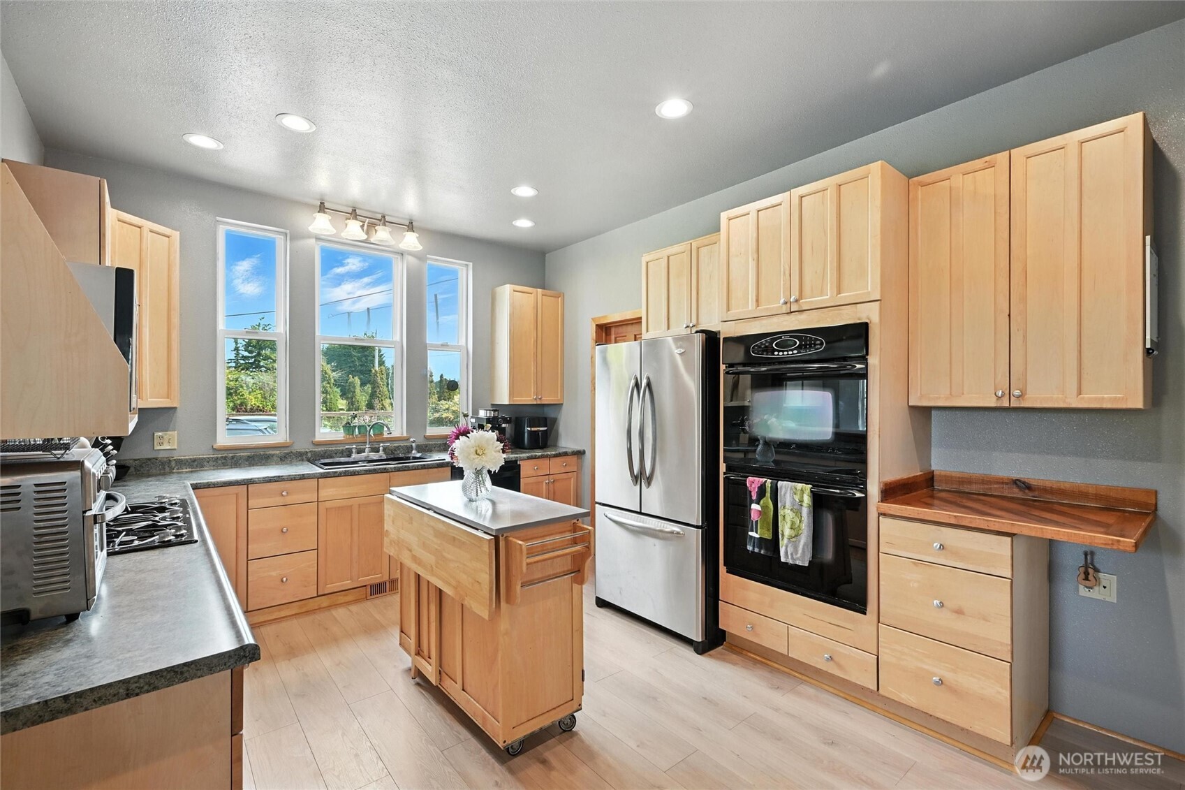 5149 Elder Road Ferndale, WA 98248 - Photo 5 of 40 a kitchen with stainless steel appliances granite countertop a refrigerator a stove a sink and a microwave
