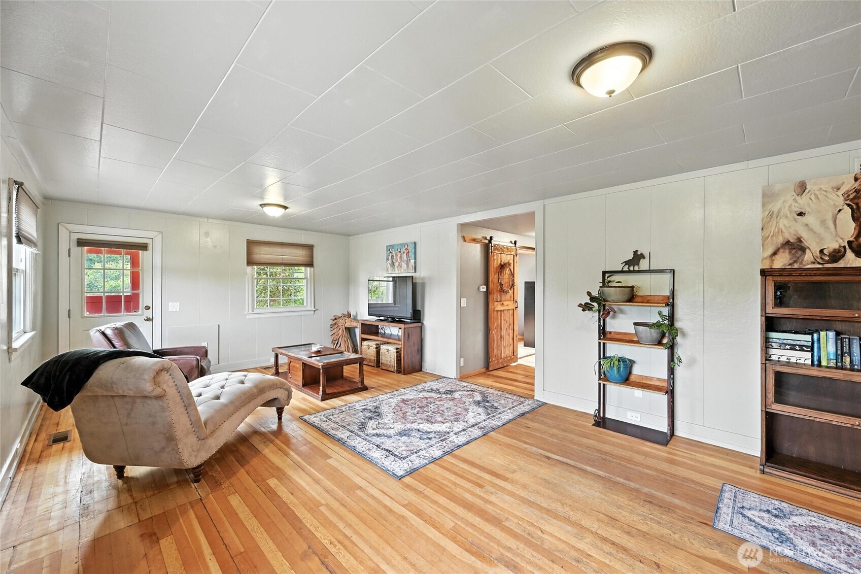 5149 Elder Road Ferndale, WA 98248 - Photo 9 of 40 a living room with furniture and a wooden floor