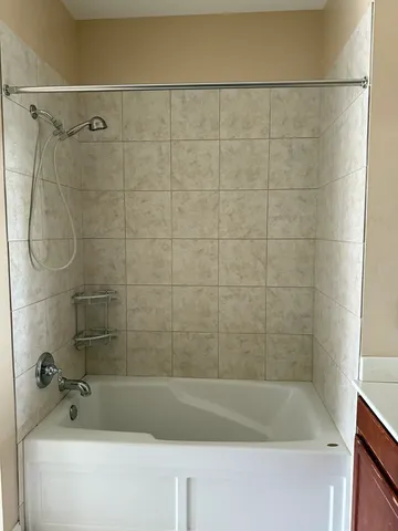 a bathroom with a shower and a bathtub