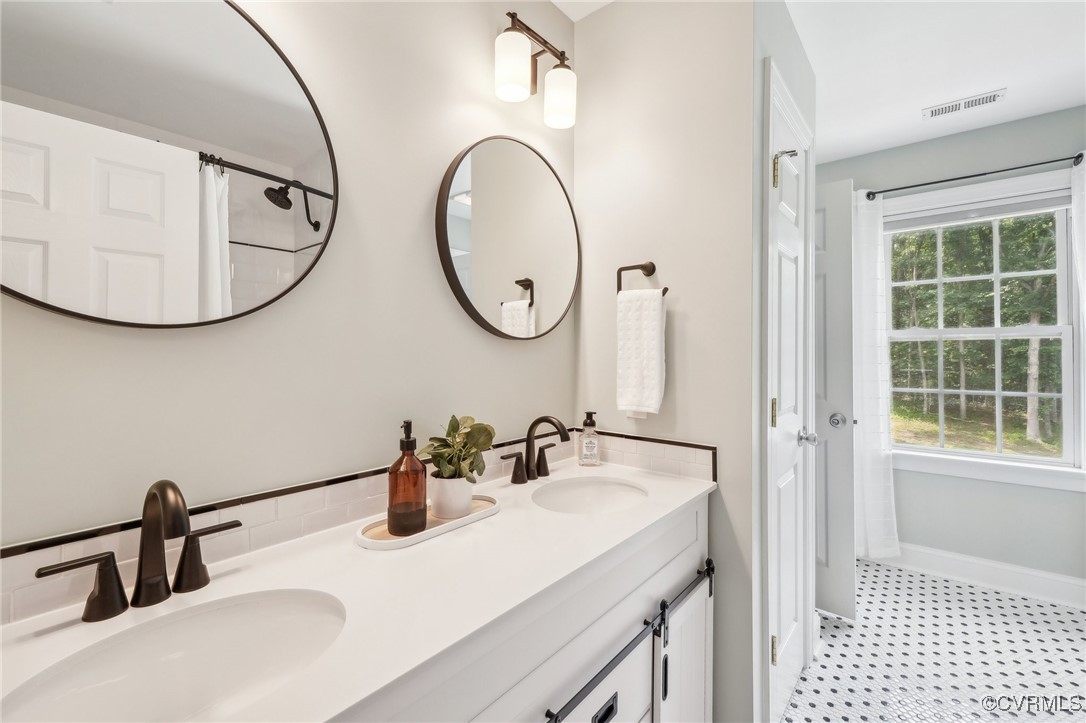 17501 Old Ridge Road Montpelier, VA 23192 - Photo 29 of 45 a bathroom with a sink and a mirror