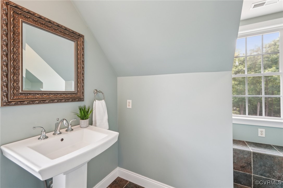 17501 Old Ridge Road Montpelier, VA 23192 - Photo 32 of 45 a bathroom with a sink and a mirror