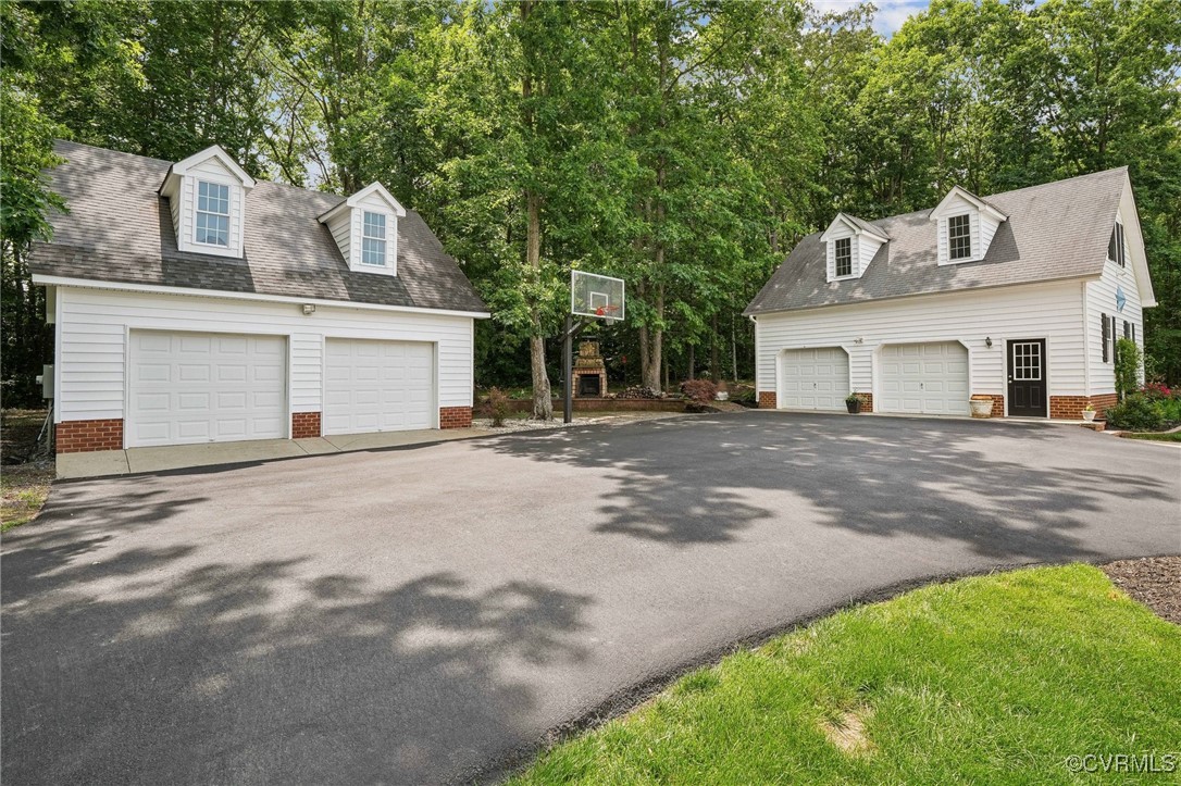 17501 Old Ridge Road Montpelier, VA 23192 - Photo 33 of 45 a front view of a house with a yard and garage