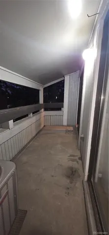 a view of a car park in back of the house