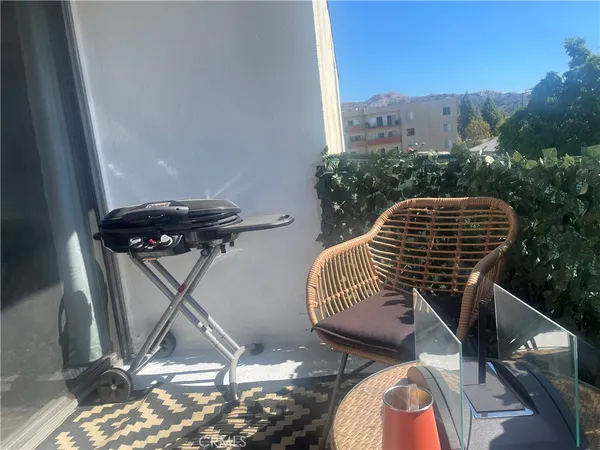 a view of balcony with furniture