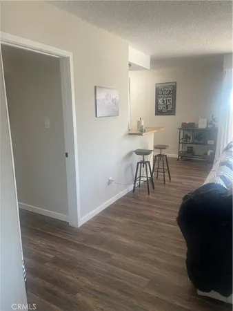 a view of a livingroom with furniture and wooden floor