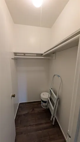 a roof deck with table and chairs