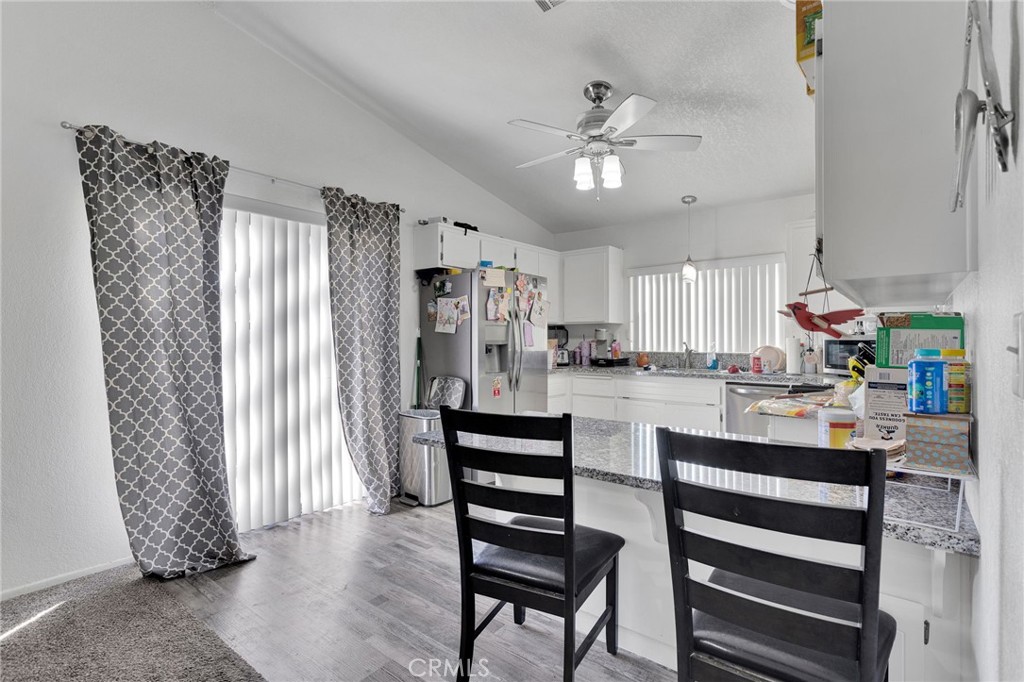 22517 Ojai Road Apple Valley, CA 92308 - Photo 16 of 25 a kitchen with a refrigerator and a sink