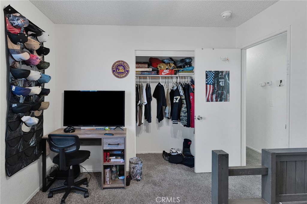 22517 Ojai Road Apple Valley, CA 92308 - Photo 18 of 25 a view of a livingroom with storage and utility room