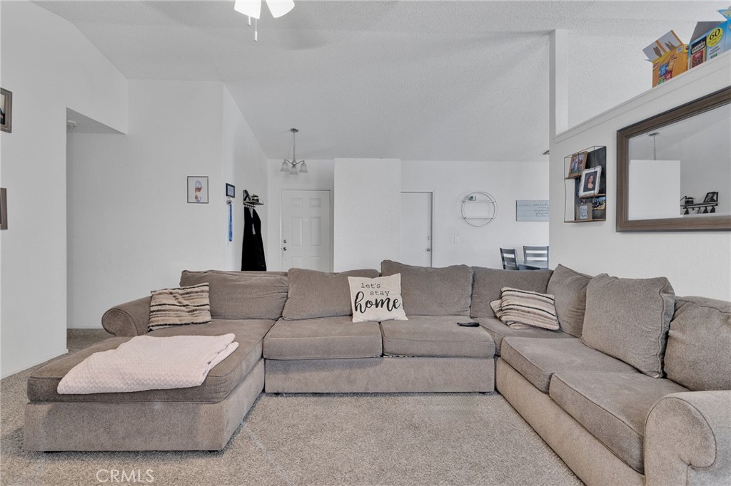 22517 Ojai Road Apple Valley, CA 92308 - Photo 5 of 25 a living room with furniture and a couch