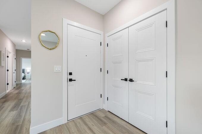 304 61st Street, Unit 1A West New York, NJ 07093 - Photo 27 of 44 a view of a hallway with wooden floor