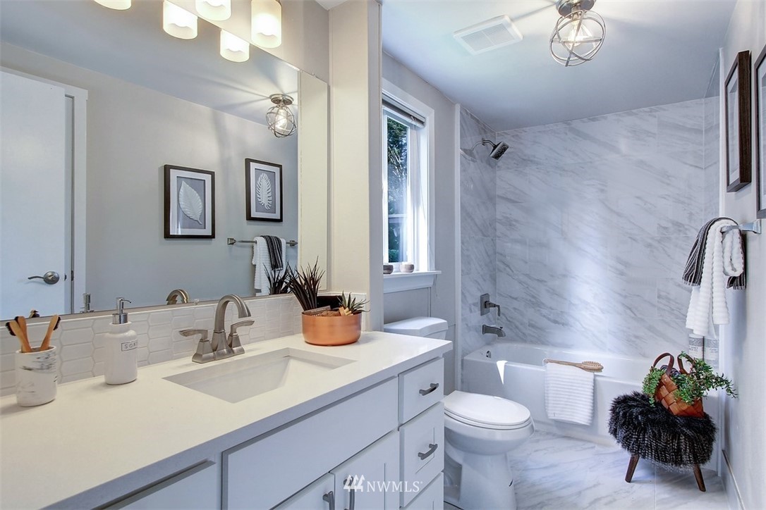 24108 7th Avenue West Bothell, WA 98021 - Photo 14 of 20 a bathroom with a sink a toilet and a mirror