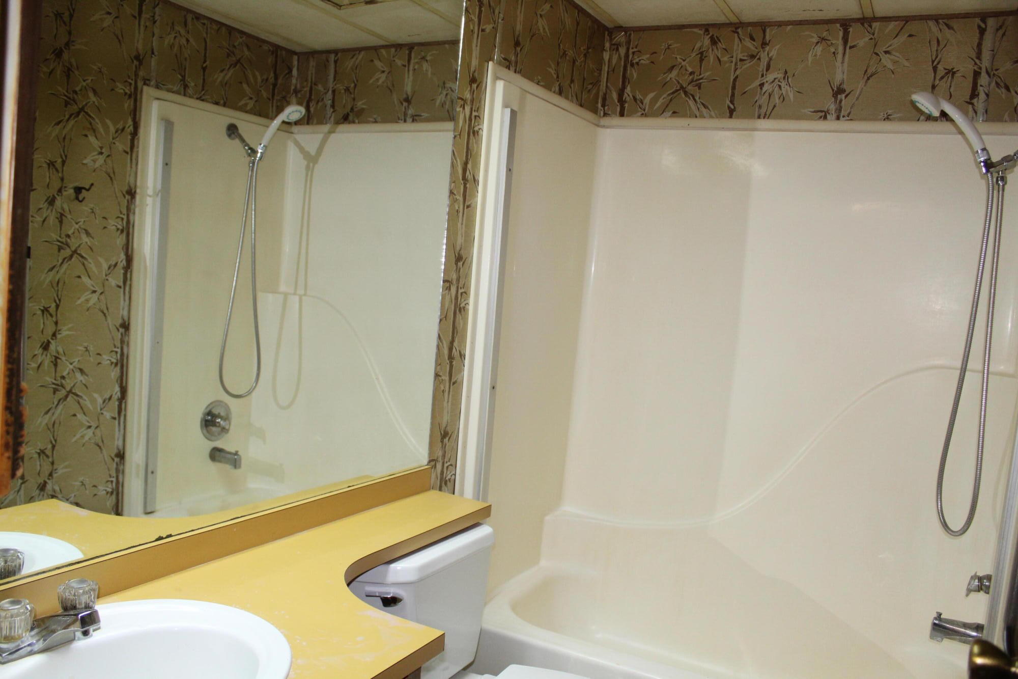 820 Queens Branch Road Rogue River, OR 97537 - Photo 11 of 32 a bathroom with a tub and shower