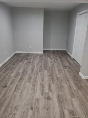 a view of room with wooden floor