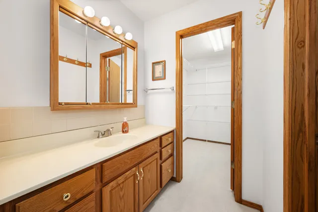 a bathroom with 2 sink and a mirror