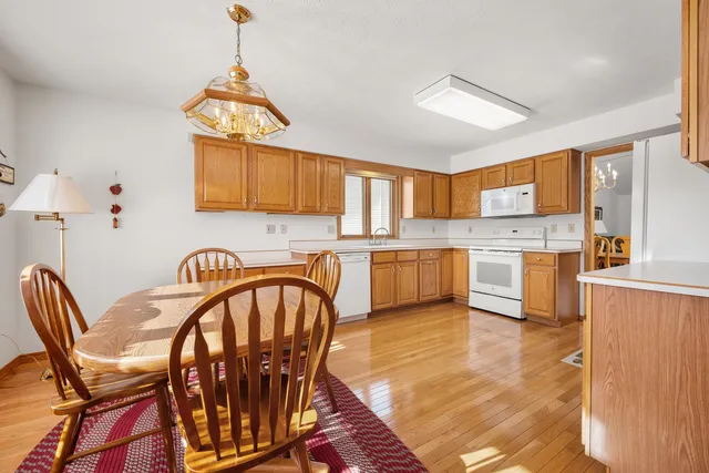 a view of kitchen with cabinets and wooden floor