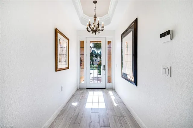 a view of a hallway with windows