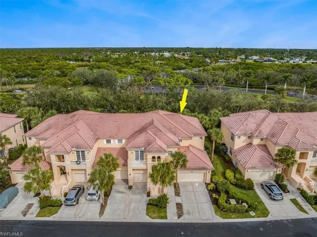 an aerial view of a house with a garden