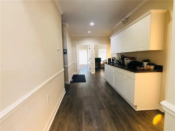a view of a living room with furniture and a fireplace