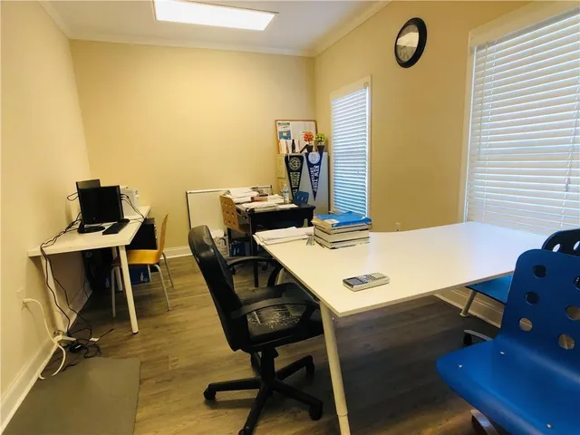 a view of a workspace with furniture