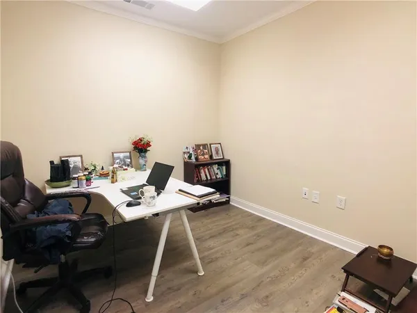 a workspace with furniture and wooden floor