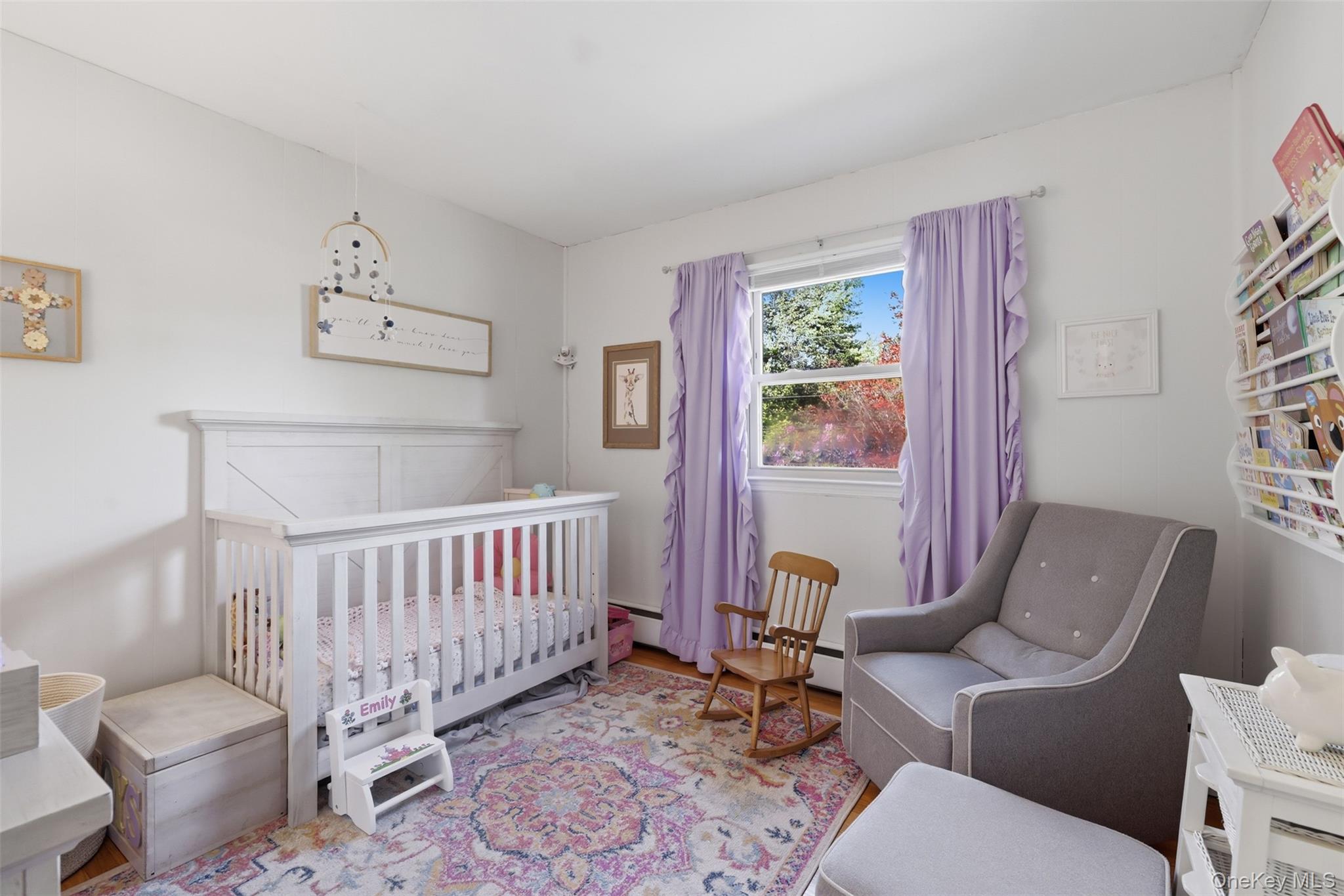 24 Beatty Road Wappingers Falls, NY 12590 - Photo 21 of 36 a living room with furniture and a baby crib