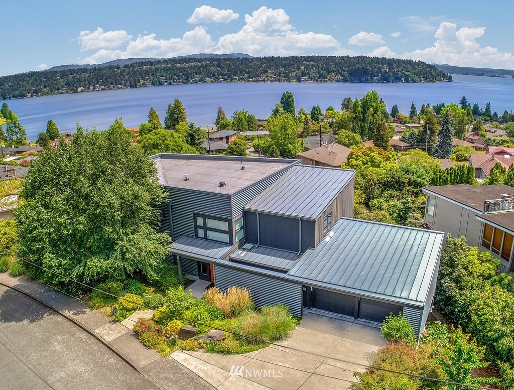5505 South Upland Road Seattle, WA 98118 - Photo 1 of 32 an aerial view of a house with a garden and pool