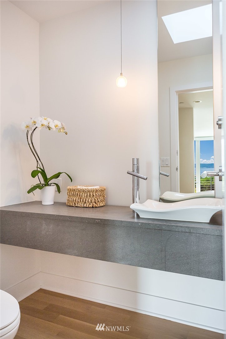 5505 South Upland Road Seattle, WA 98118 - Photo 12 of 32 a bathroom with a sink and mirror