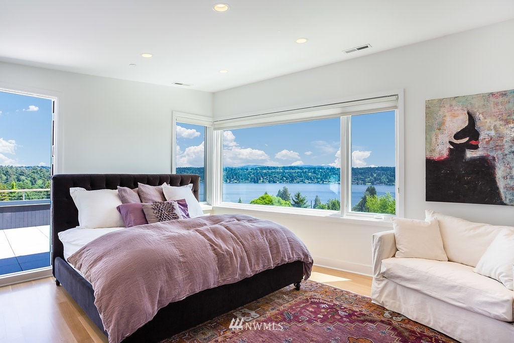 5505 South Upland Road Seattle, WA 98118 - Photo 13 of 32 a bedroom with a bed and a large window