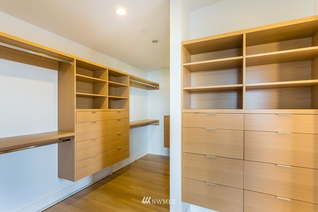 5505 South Upland Road Seattle, WA 98118 - Photo 16 of 32 a view of walk in closet with empty racks