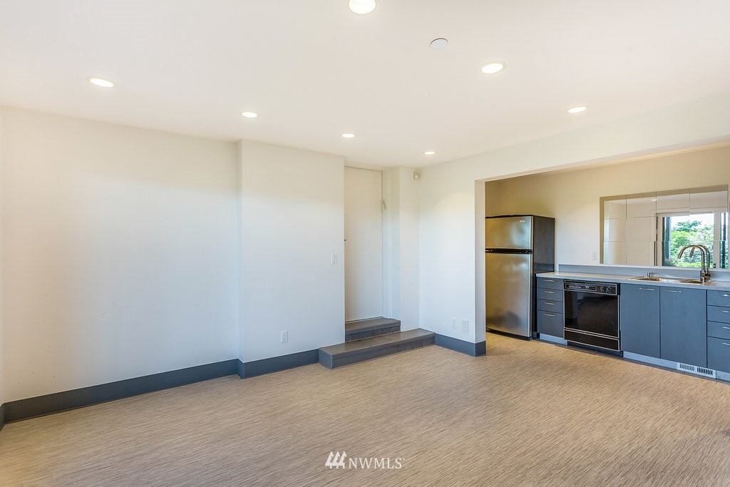 5505 South Upland Road Seattle, WA 98118 - Photo 25 of 32 a view of empty room with a kitchen