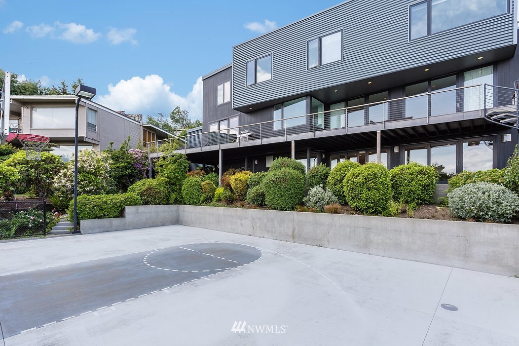 5505 South Upland Road Seattle, WA 98118 - Photo 27 of 32 a view of a building with a garden