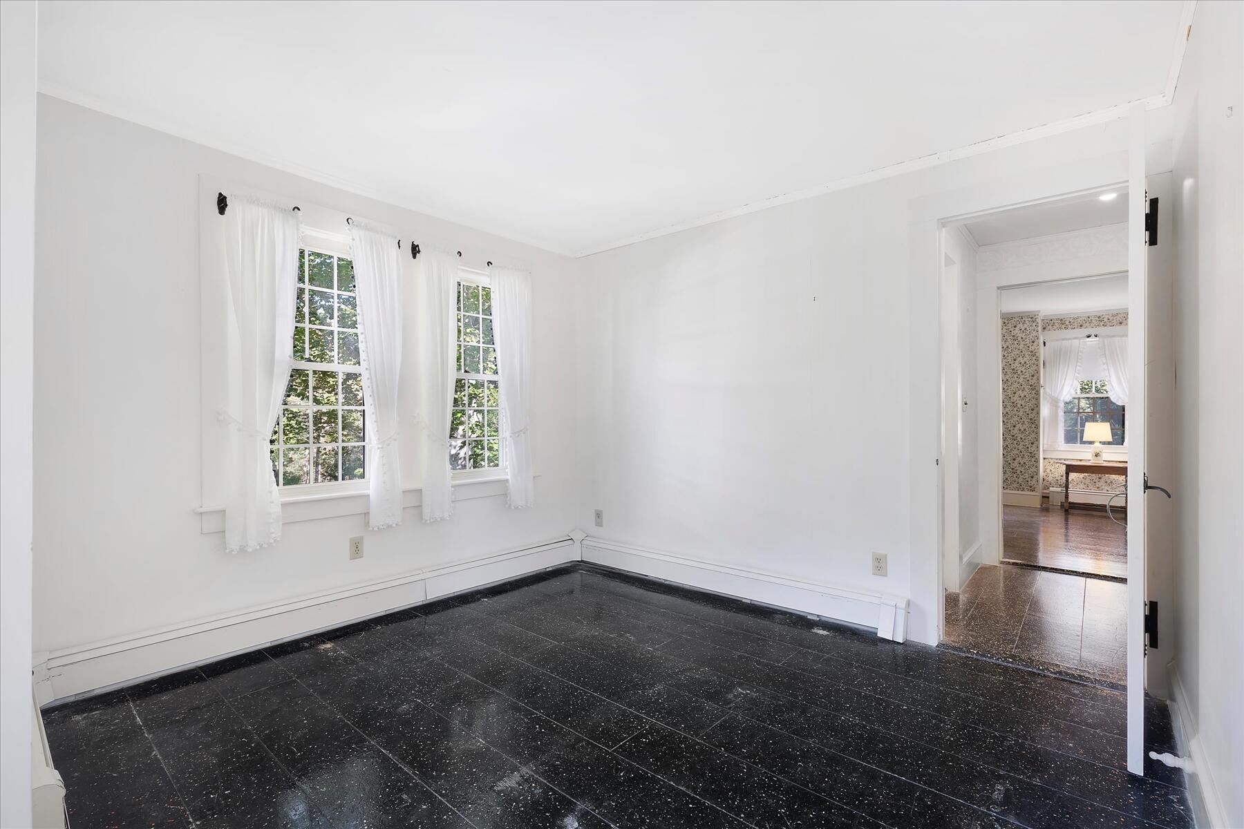 307 Bank Street Harwich, MA 02645 - Photo 18 of 45 an empty room with wooden floor and windows