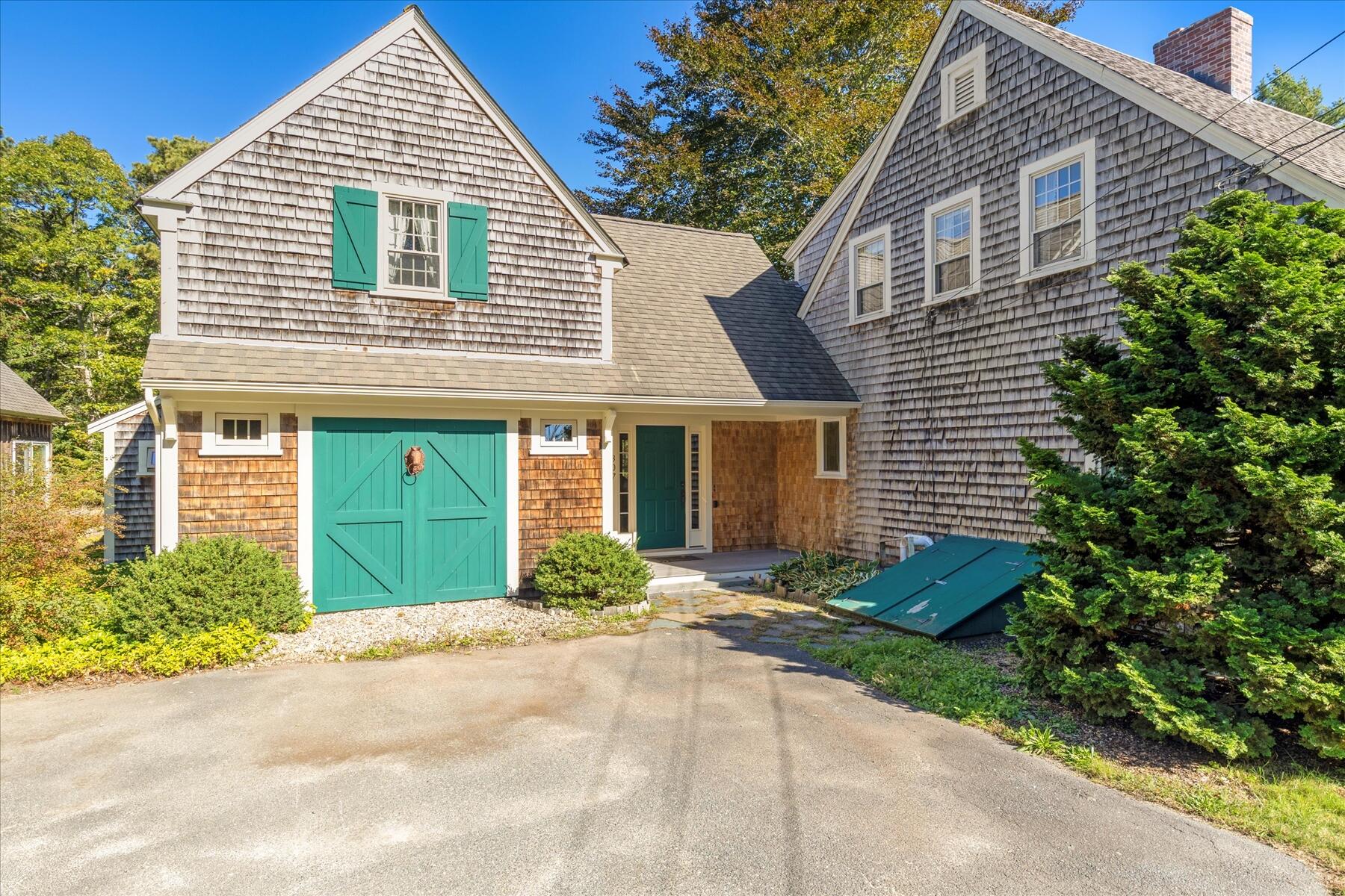 307 Bank Street Harwich, MA 02645 - Photo 2 of 45 a view of a house with a yard and potted plants