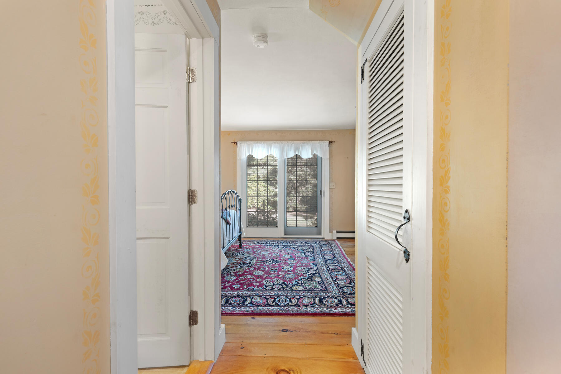 307 Bank Street Harwich, MA 02645 - Photo 21 of 45 a view of a hallway with wooden floor and a livingroom